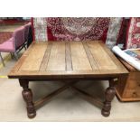 Extending dining table with turned legs and cross stretchers