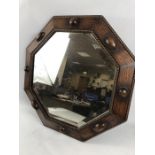 Octagonal wooden framed bevel edged mirror approx 55cm x 55cm