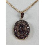 15ct Gold Chain (approx 7.8g) 49cm long with Gold coloured locket set with garnets one side a