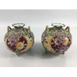 Pair of Continental hand painted vases on Tripod feet with raised decoration approx 10cm tall