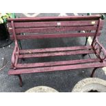 Wrought iron bench with wooden slats