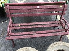 Wrought iron bench with wooden slats