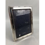 Hallmarked silver photo frame by Garrard & Co Ltd with leather back plate approx 16 x 21.5cm