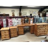 Bedroom pine suite of dressing table with mirror, chest of five drawers and two bedside cabinets