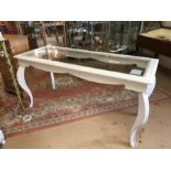 Large white painted french-style bombe-legged display table with glass top. Approx dimensions
