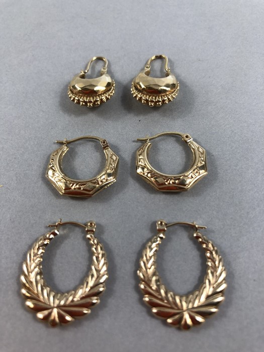 Three pairs of 9ct Gold earrings of various designs (approx 4g)