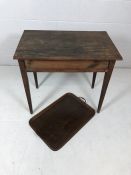 Oak occasional table on tapering legs along with a butlers tray