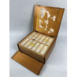 A mid century set of etymology, botany & zoology specimen slides in a pine case with original