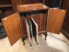 Record cabinet by Arnold with eighteen compartments containing large collection of records