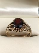 9ct Gold ring set with a single garnet