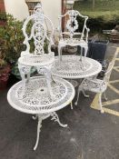 Two decorative wrought iron white painted garden tables and three chairs