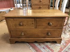 Low pine chest of three drawers