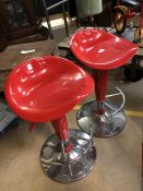 Pair of red plastic and chrome moulded bar stools