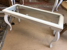 White painted french-style bombe-legged low table with glass top. Approx dimensions 122cm x 50cm x