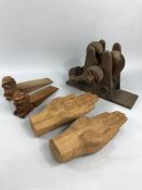 Collection of wooden items to include doorstops and a pair of carved wooden hands