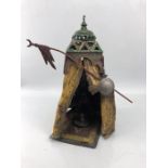 Cold painted bronze of a figure in tent, approx height 33cm
