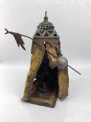 Cold painted bronze of a figure in tent, approx height 33cm