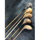 Collection of five vintage golf clubs