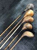 Collection of five vintage golf clubs