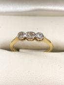 Three stone Diamond and Gold ring (hallmarks rubbed) size 'H'