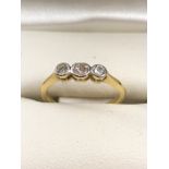 Three stone Diamond and Gold ring (hallmarks rubbed) size 'H'