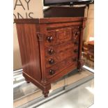 Apprentice piece chest of drawers, each drawer with turned wood handles, flanked by turned
