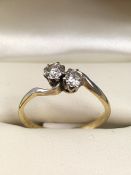 18ct Gold and platinum set two stone diamond crossover ring, diamonds approx 0.25ct each, size 'Q'