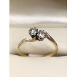 18ct Gold and platinum set two stone diamond crossover ring, diamonds approx 0.25ct each, size 'Q'