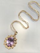 9ct Gold fine link chain with 375 9ct gold mount for a faceted purple stone. (total weight approx