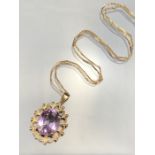 9ct Gold fine link chain with 375 9ct gold mount for a faceted purple stone. (total weight approx