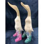 Pair of ornamental carved wooden ducks in 'Hunter' style wellies approx 50cm in height