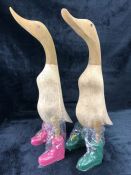Pair of ornamental carved wooden ducks in 'Hunter' style wellies approx 50cm in height