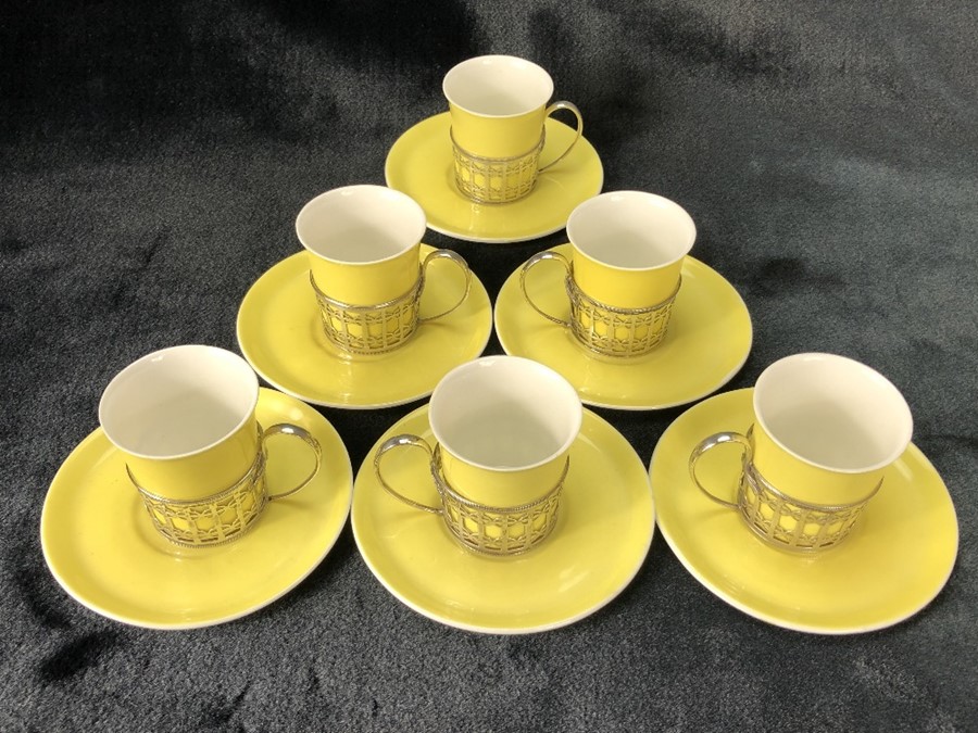 Set of six Shelley espresso cups and saucers in yellow with hallmarked silver holders