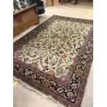 Large cream ground antique rug with blue and pink floral design, approx dimensions 385cm x 260cm