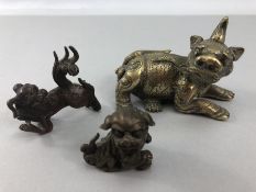 Three Opium weights in the form of Foo dogs/ dogs of Fo, bronze and brass
