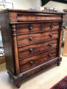 Victorian flame mahogany chest of six drawers with column detail on four bun feet
