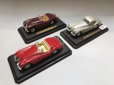 Three die-cast collectable Jaguar models all XK 120 models