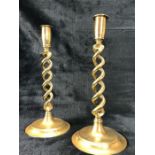 Pair of brass candlesticks with twisted design. Approx height 30cm