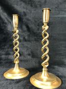 Pair of brass candlesticks with twisted design. Approx height 30cm