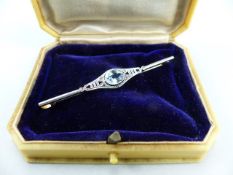 Edwardian Unmarked Gold and Platinum Bar Brooch, set with an approx: 6.75mm x 8.9mm oval Aqua