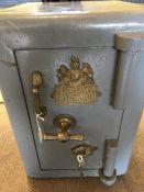 Vintage safe by "R. TANN'S TWELVE CORNER DEFIANCE SAFE. LONDON FIELDS LONDON." Grey with brass