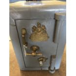 Vintage safe by "R. TANN'S TWELVE CORNER DEFIANCE SAFE. LONDON FIELDS LONDON." Grey with brass