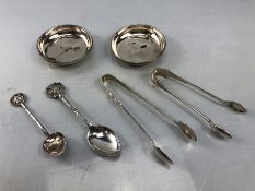Collection of Hallmarked silver items to include sugar nips, spoons and two pin trays approx 92g