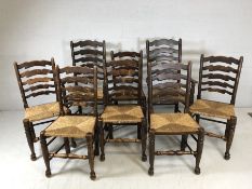 Set of rush-seated ladder back dining chairs - two carvers and six chairs