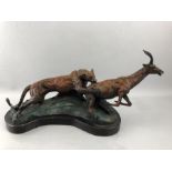 Cast bronze model of a panther and a stag on plinth, approx length 59cm