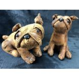 Two decorative leather dogs, approx 27cm and 23cm tall