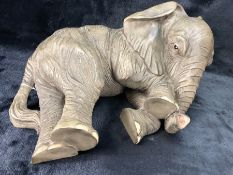 Figure of a recumbent elephant, approx length 60cm