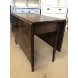 Antique drop leaf table on tapered legs, approx 138cm x 101cm when extended