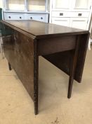 Antique drop leaf table on tapered legs, approx 138cm x 101cm when extended