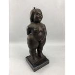 Figurine of a rotund lady with eyes closed, marked SIKA, approx 37cm tall